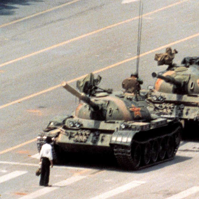 A anonymous man stands in front of a column of tanks on June 5, 1989, the morning after the Chinese military had suppressed the Tiananmen Square protests of 1989 by force, who later became known as the Tank Man. The tanks maneuvered to pass by the man, and he moved to continue to obstruct them, in something like a dance.